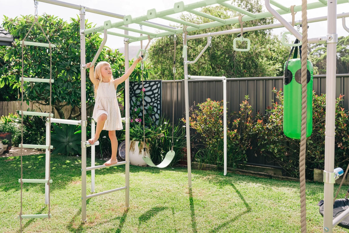 Adjustable Steps in use on a Growplay frame in a family garden