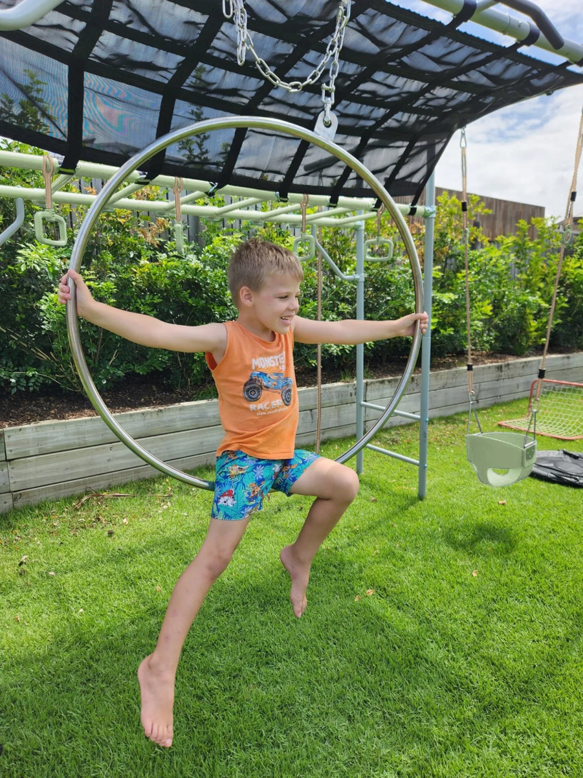 Aerial Hoop in use on a Growplay frame in a family garden
