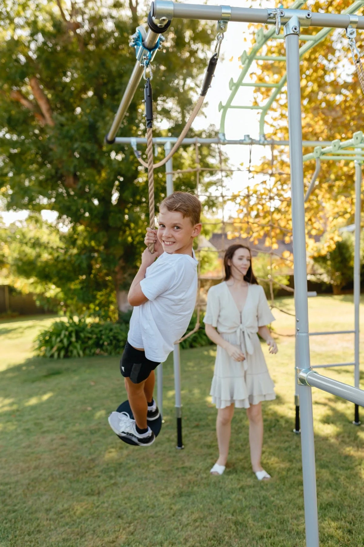 Flying Fox (Zip Line) in use on a Growplay frame in a family garden