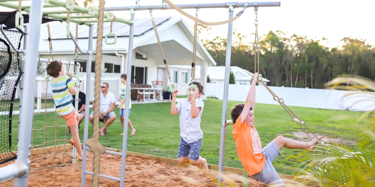 Gym Rings in use on a Growplay frame in a family garden
