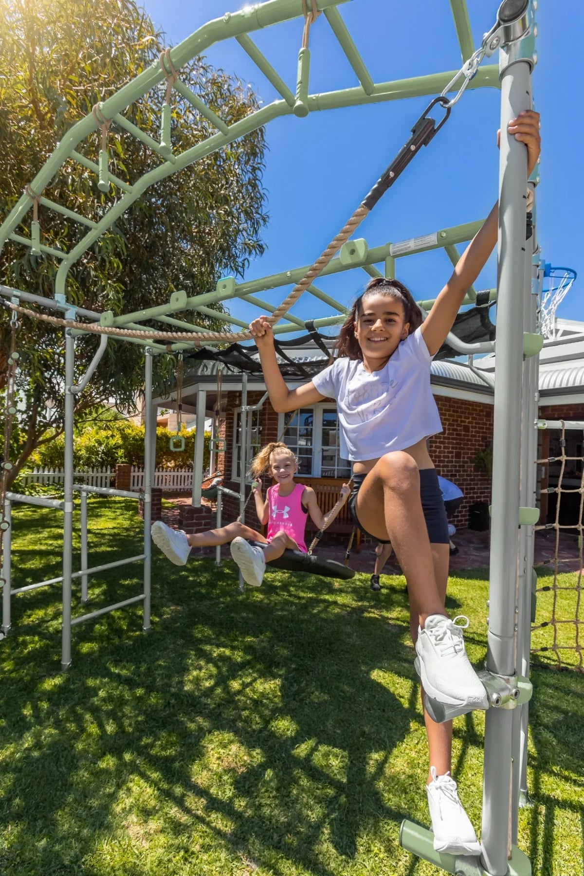 Traverse Rope in use on a Growplay frame in a family garden