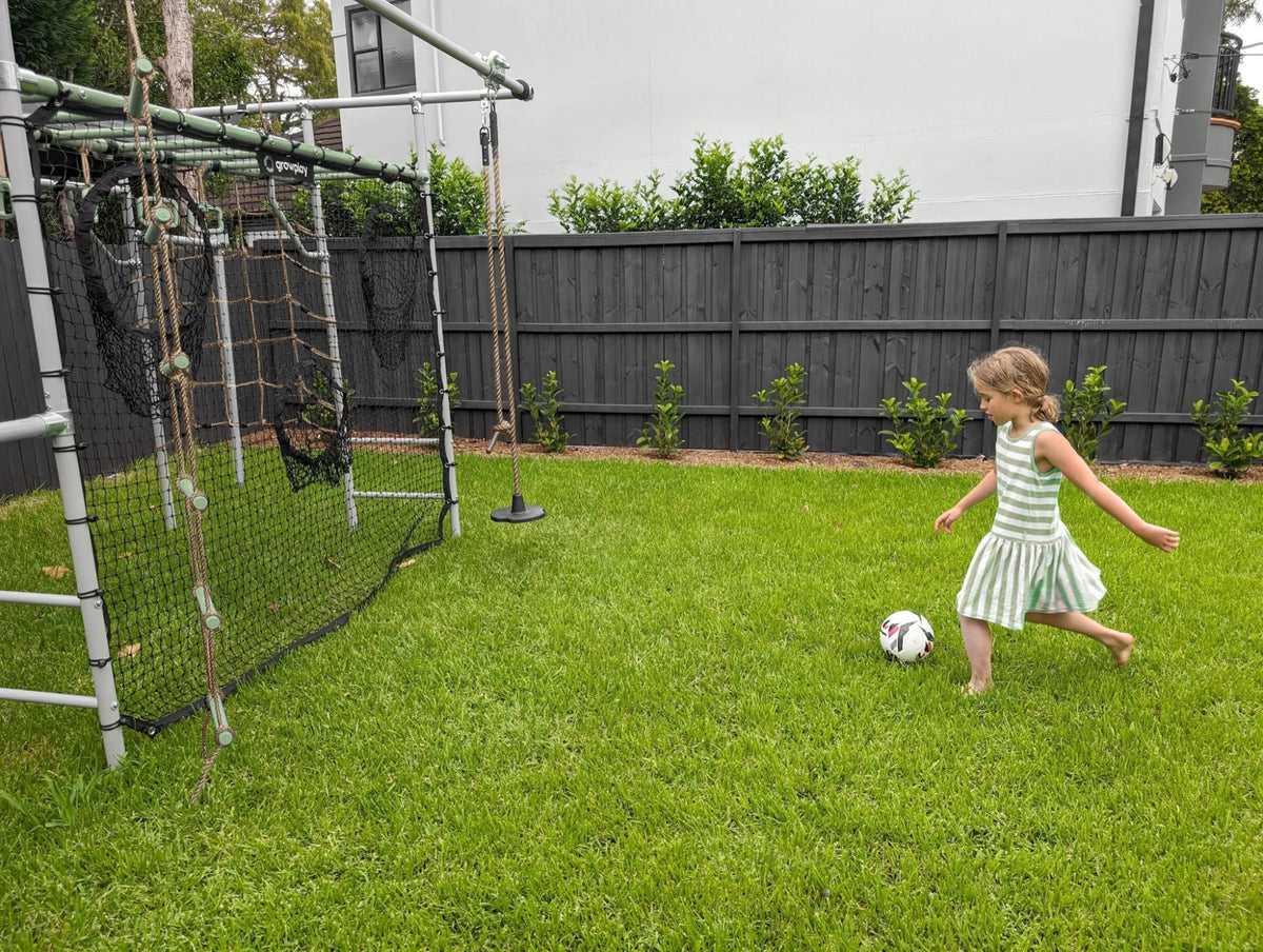 Football Net in use on a Growplay frame in a family garden