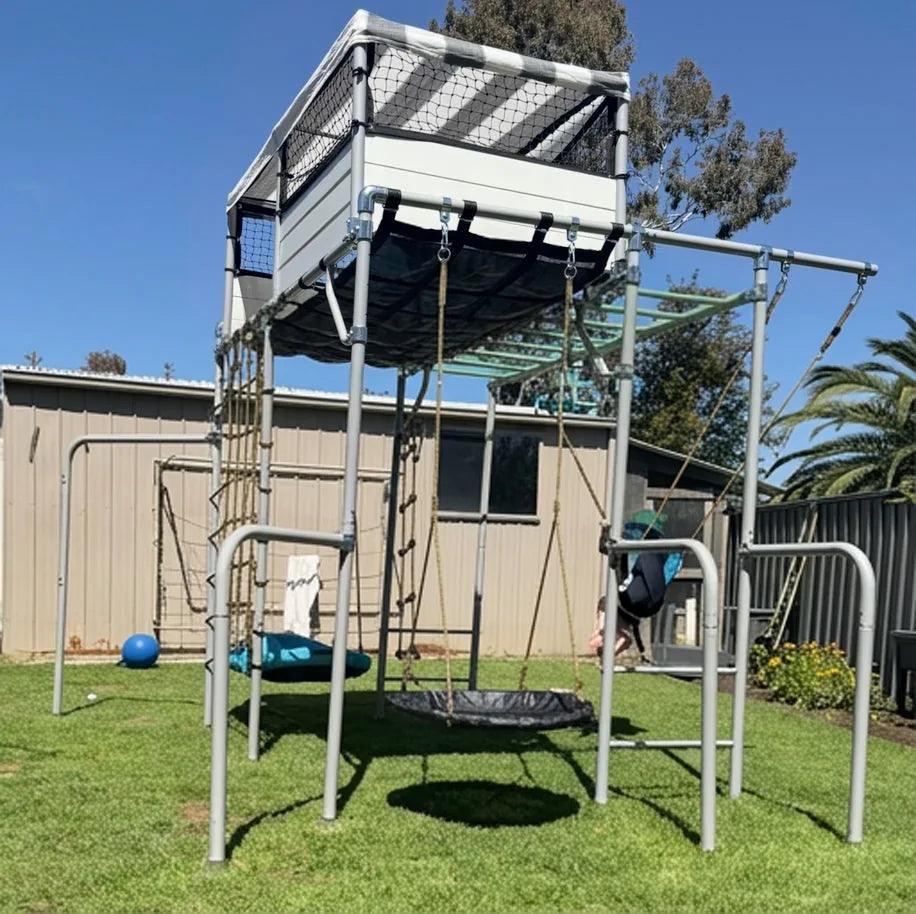LARGE PLAYHOUSE in green in a family garden